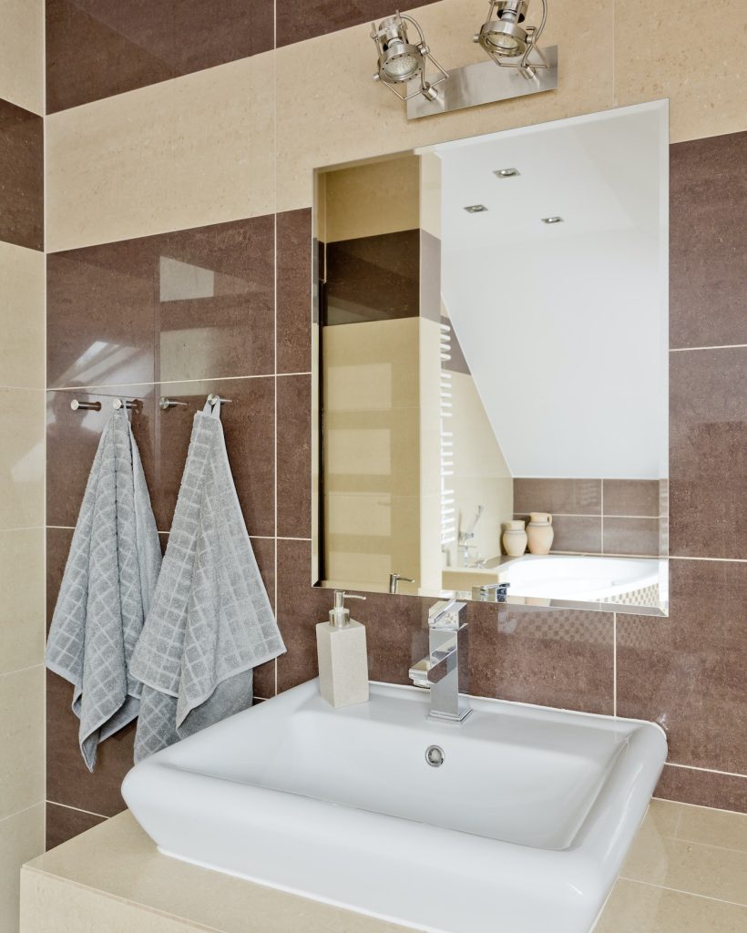 Modern bathroom with beige tiles
