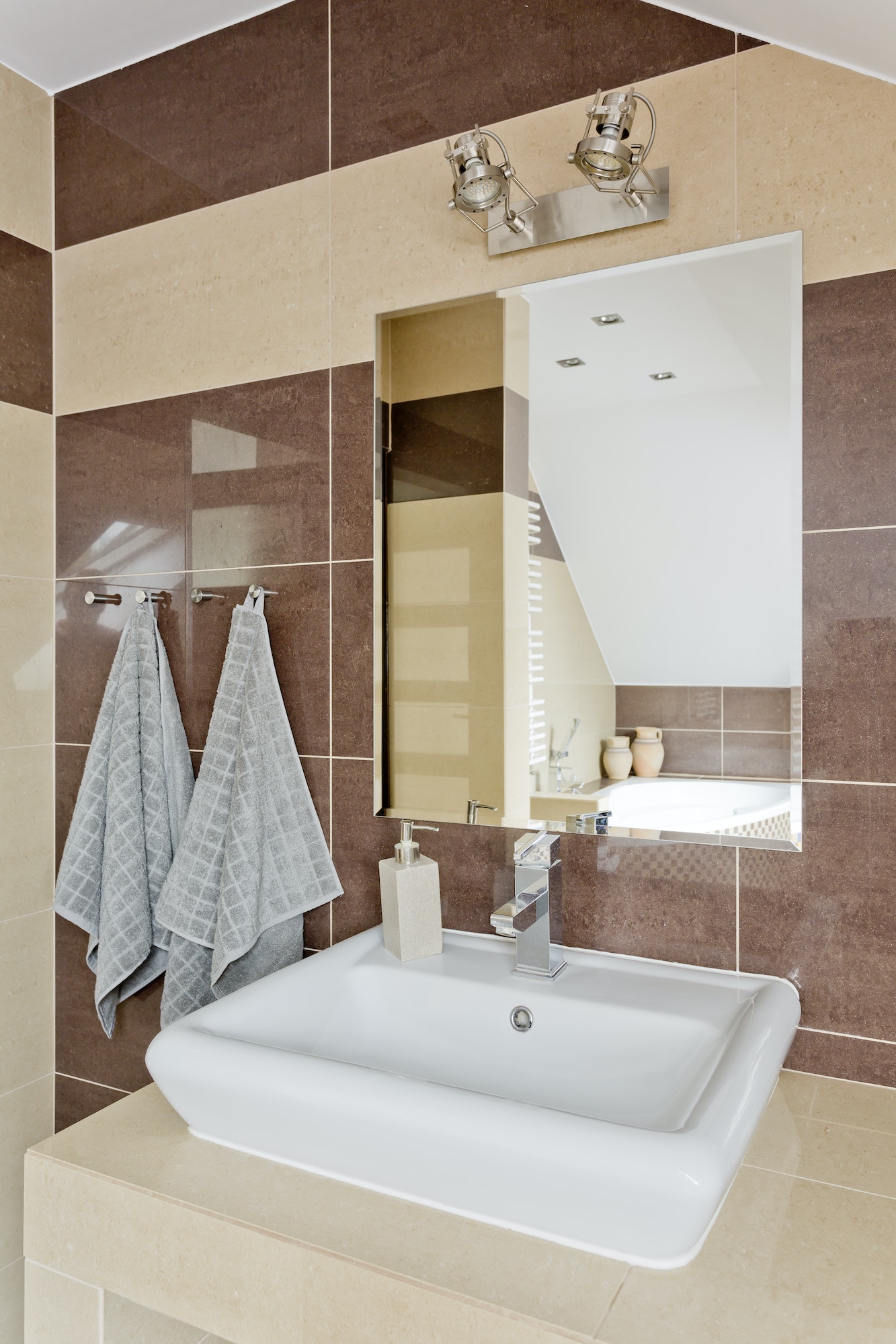 Modern bathroom with beige tiles